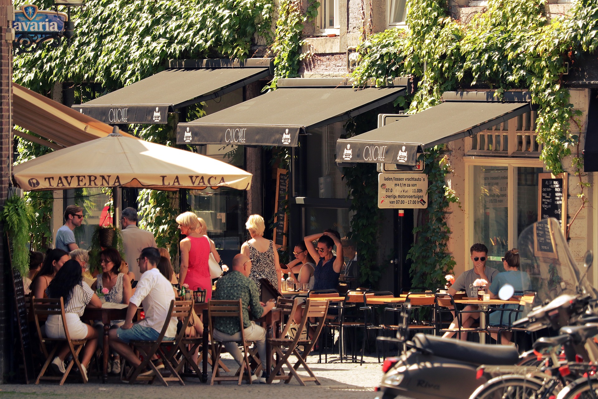 lively and relaxing outdoor seating area with table, chairs, and tents